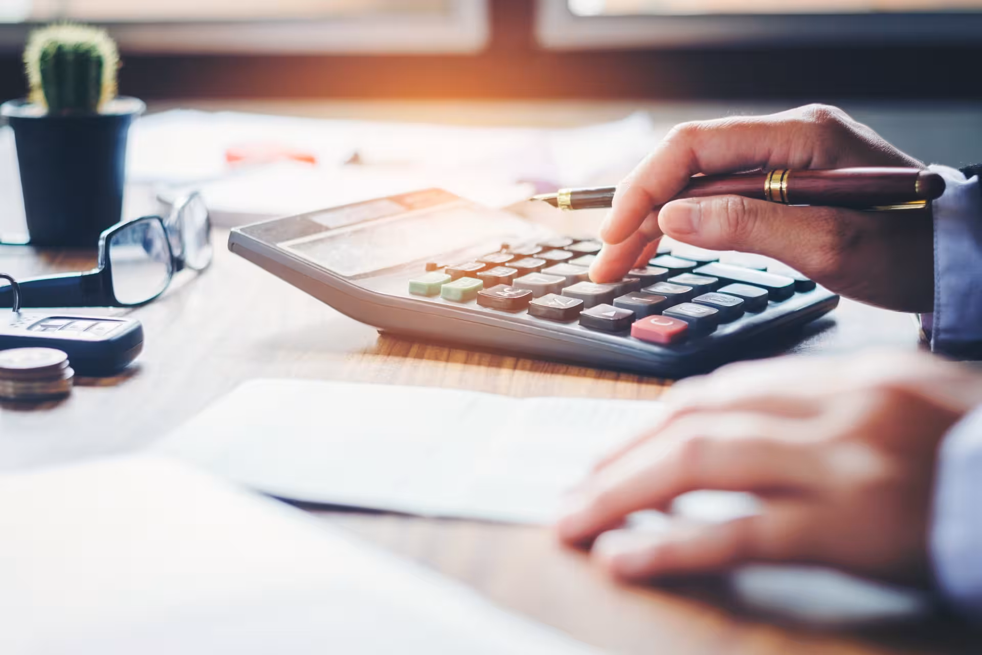 Man doing calculations on a calculator