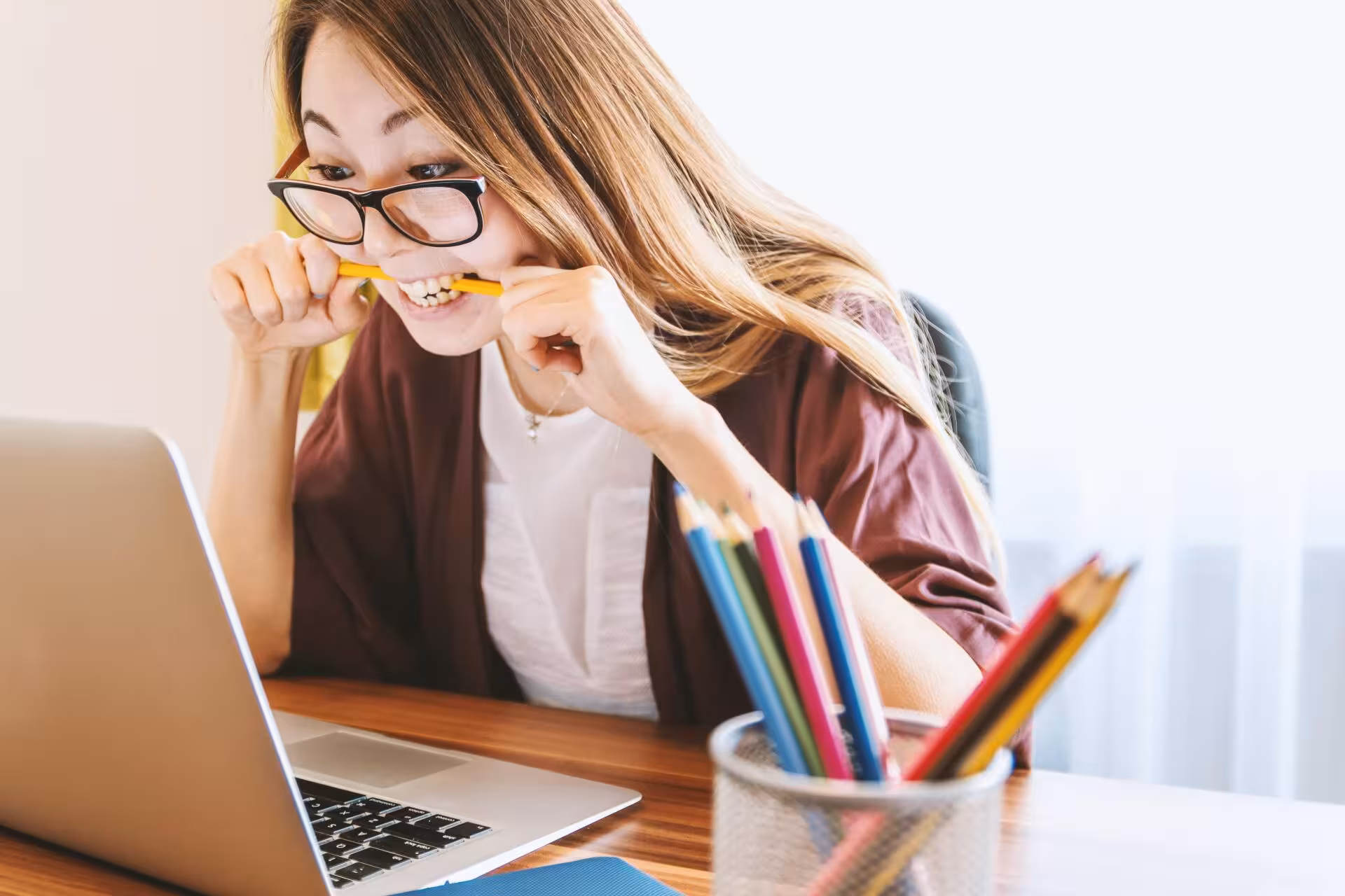 women looking at a computer anxiously